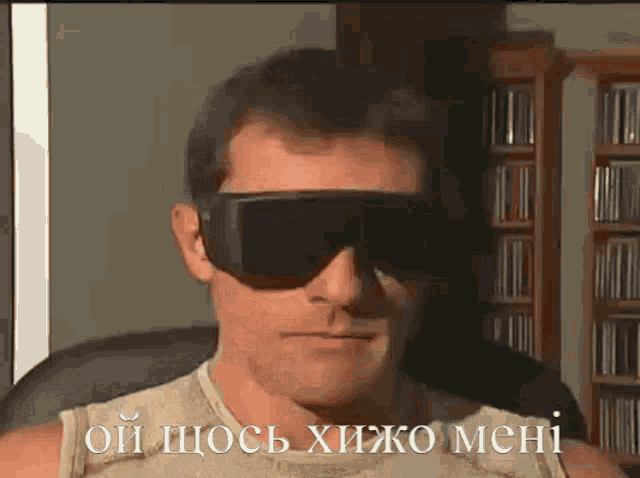 a man wearing sunglasses says " oi chose xijo mehi " in a foreign language