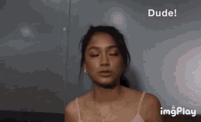 a girl is making a funny face and the words she 's yo motha are above her