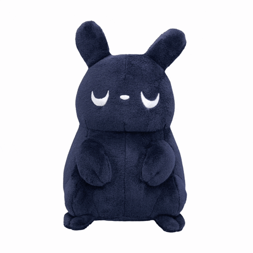 a stuffed animal with a crescent moon on it 's face