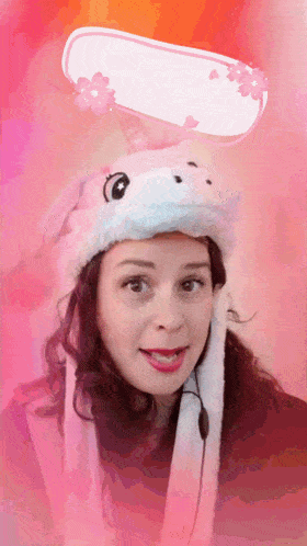 a woman wearing a unicorn hat with a crazy speech bubble above her head