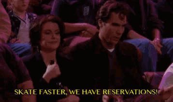 a man and a woman are sitting in a crowd with the words skate faster we have reservations .