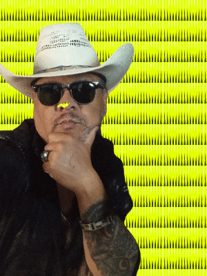 a man wearing a cowboy hat and sunglasses is thinking