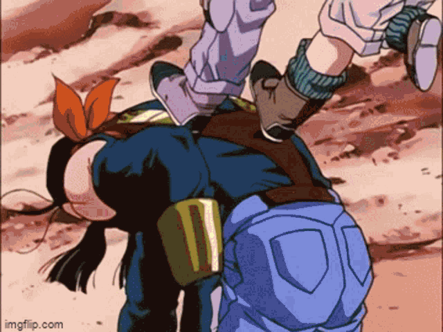 a couple of people are standing next to each other and one of them is laying on the ground .
