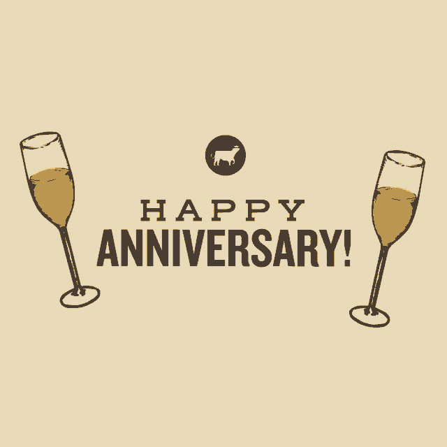 a poster that says happy anniversary with two glasses of wine