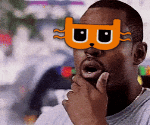 a man wearing a mask with the letter b on it is thinking
