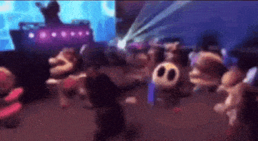 a group of cartoon characters are dancing in a room with a dj .