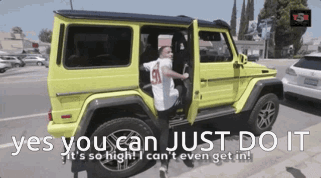 a man getting out of a yellow jeep with the words " yes you can just do it " below him