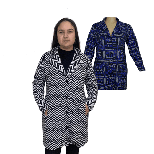a woman is wearing a black and white jacket and a blue shirt