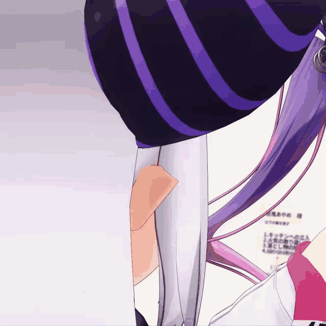 a purple and black striped hat is on a girl