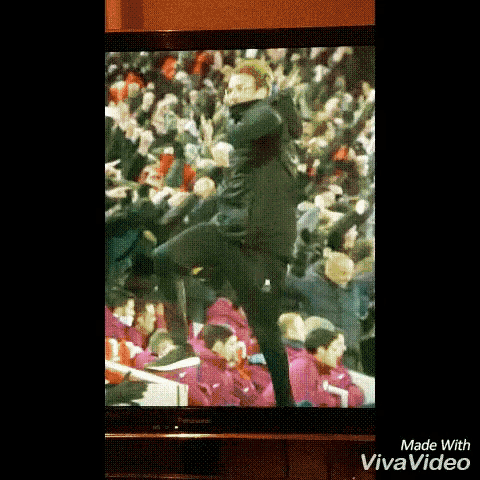 a tv screen shows a man dancing in front of a crowd and the words made with vivavideo