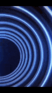 a close up of a blue light circle on a dark background