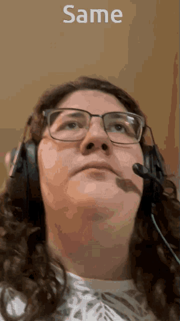 a woman wearing headphones and a microphone with the word same above her