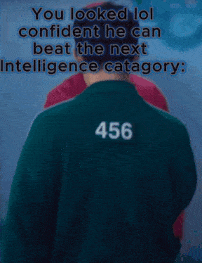 a man in a green jacket has a red x on his shirt