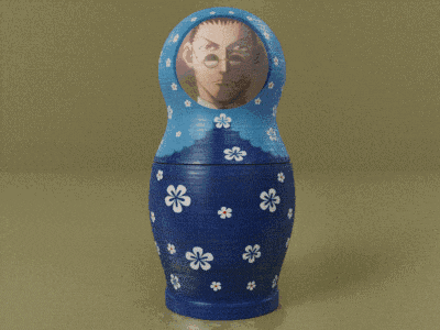 a blue green and orange russian nesting doll with a man 's face on it