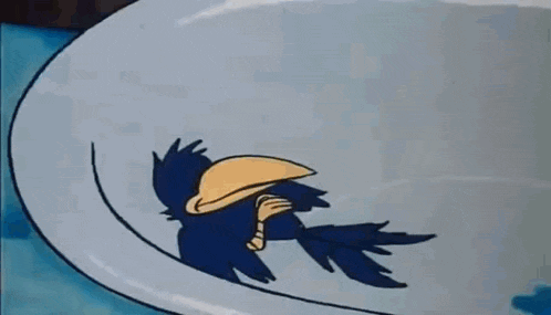 a cartoon bird with a large beak is laying on top of a white object .