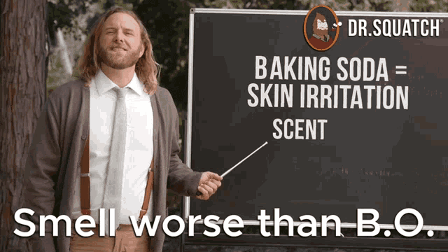 a man stands in front of a blackboard that says baking soda = skin irritation scent smell worse than b.o.