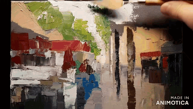 a painting is being painted on a canvas and the words made in animotica are on the bottom