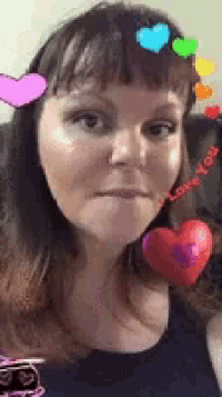 a woman with hearts in her hair and the words i love you on her face