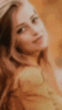 a blurry picture of a woman with a hat on her head