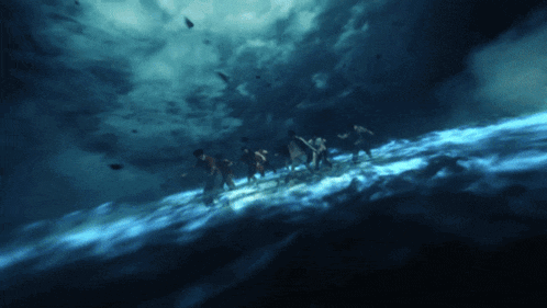 a group of people are walking in the water