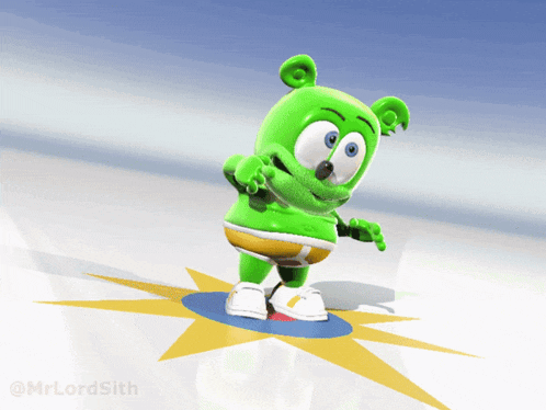 a green gummy bear standing on a blue and yellow star