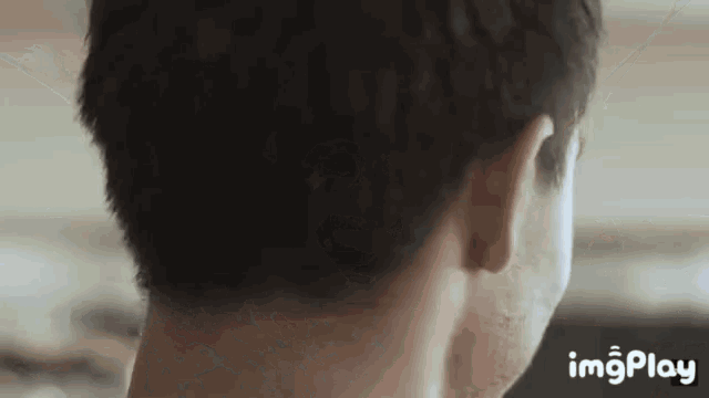 a close up of a man 's neck and ear