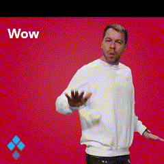 a man in a white sweater is standing in front of a red background with the word wow on it .