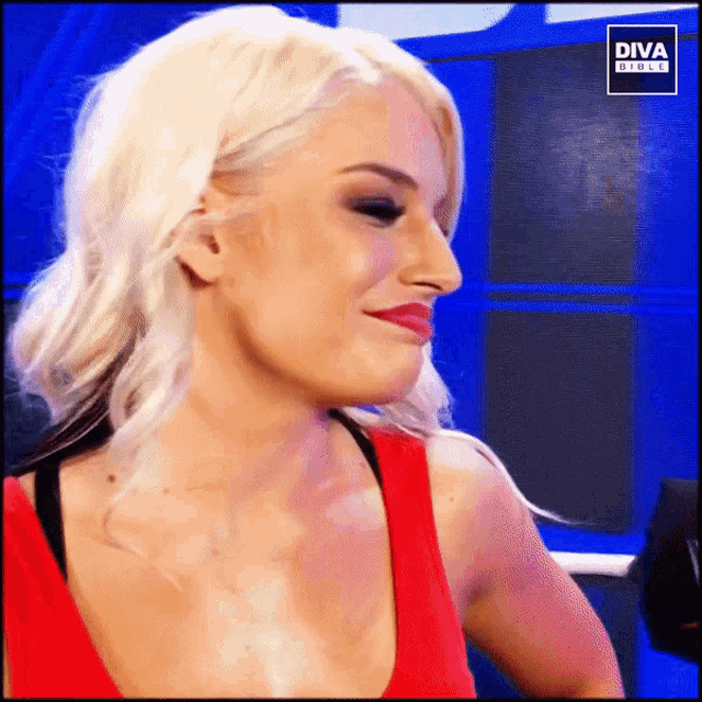 a woman in a red tank top with diva direct written on it