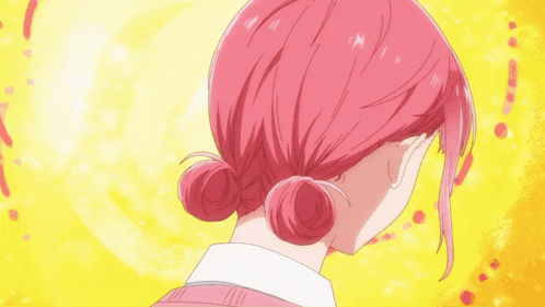 a girl with pink hair has two buns on her hair