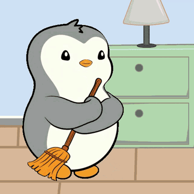 a penguin is sweeping the floor with a broom in a room .
