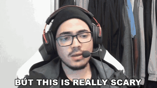 a man wearing headphones and a hat says but this is really scary
