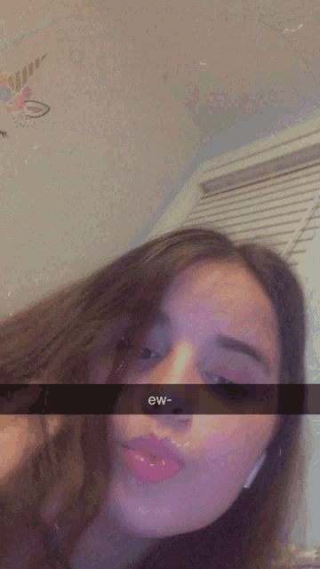 a close up of a woman 's face with a caption that says eww