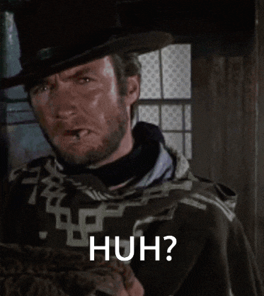 a man with a beard is wearing a top hat and a cape and says huh .