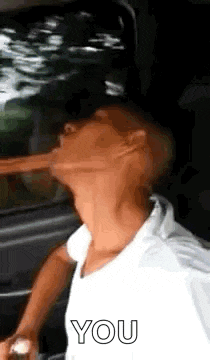a man with a long nose is drinking from a bottle .