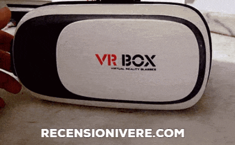 a person is wearing a virtual reality headset that says vr box