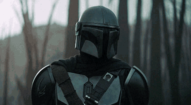 a close up of a man wearing a helmet and armor