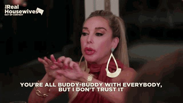 a woman says you 're all buddy buddy with everybody but i don t trust it
