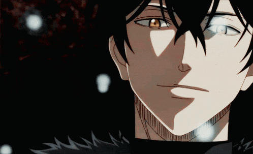 a close up of a person 's face with black hair