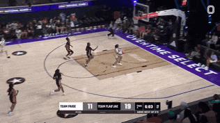 a basketball game is being played in front of an overtime select sign