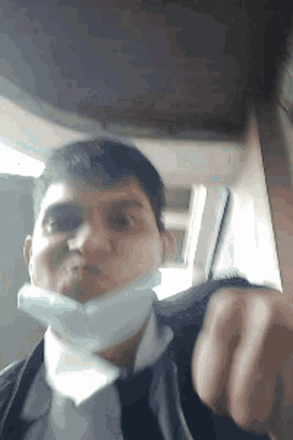 a man wearing a mask is making a face