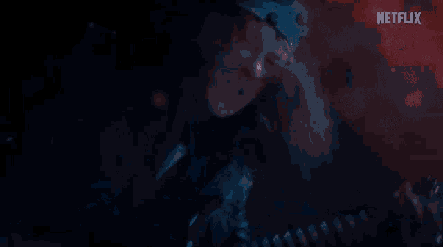 a netflix advertisement shows a man playing a guitar