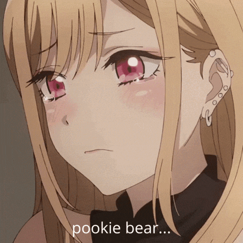 a close up of a girl 's face with the words pookie bear below her
