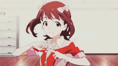 a girl is covering her ears with her hands while standing in a room .