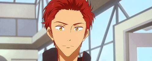 a cartoon character with red hair and yellow eyes is looking at the camera