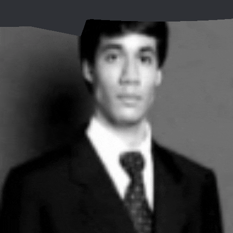 a black and white photo of a man in a suit