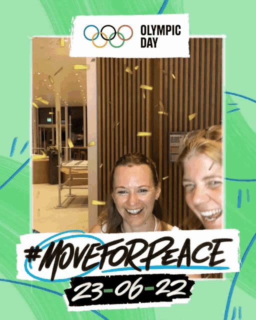 two women are smiling in front of a sign that says olympic day on it