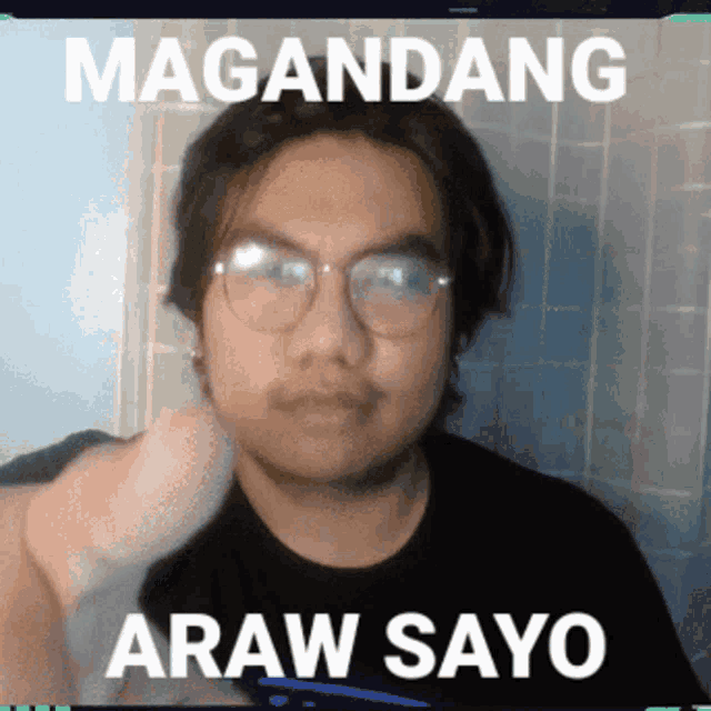 a man wearing glasses is giving a thumbs up with the words magandang araw sayo below him