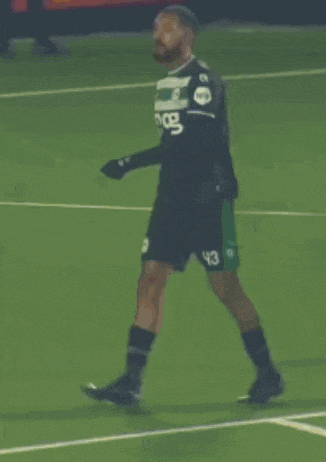 two soccer players on a field with the words calma calma calma
