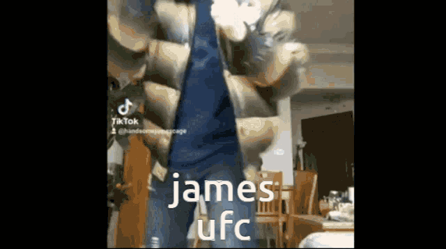 a man is dancing in a living room with the words `` james ufc '' on the bottom .