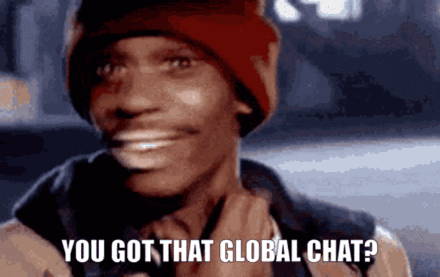 a man wearing a red beanie is smiling and says you got that global chat